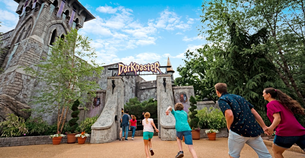 Family rushing to ride DarKoaster™ at Busch Gardens Williamsburg.