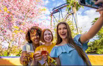 Group of three friends taking a selfie at Busch Gardens Tampa Bay Food & Wine Festival